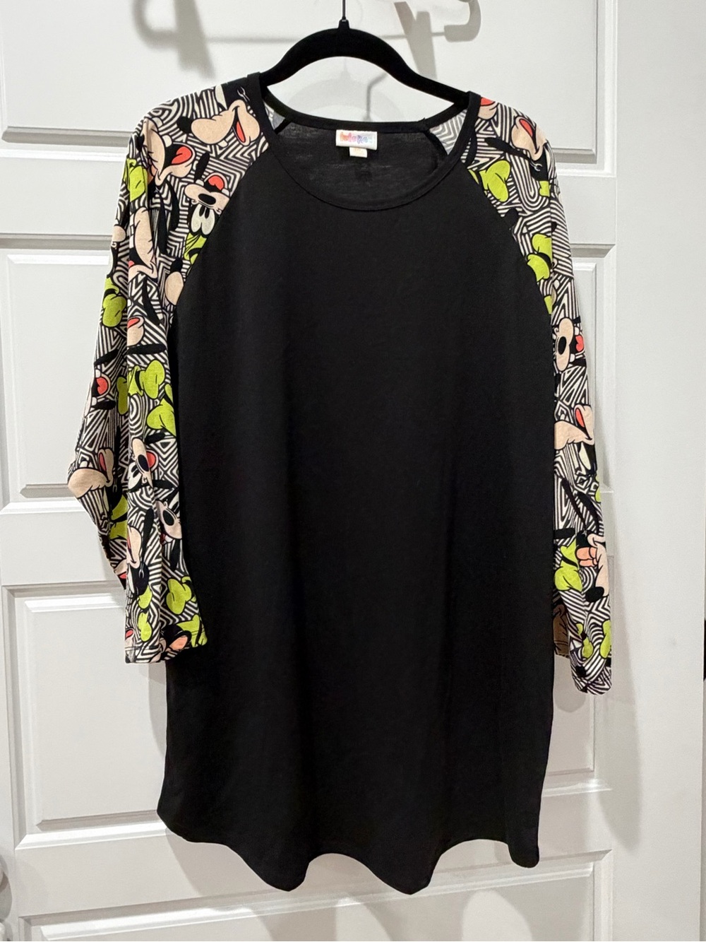 LuLaRoe Black Tunic with Floral Geometric Raglan Sleeves